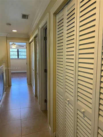 a bedroom with bed and a window