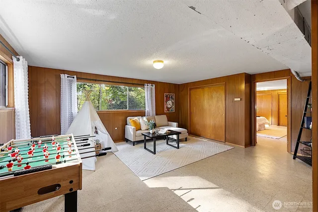 a bedroom with furniture and a window