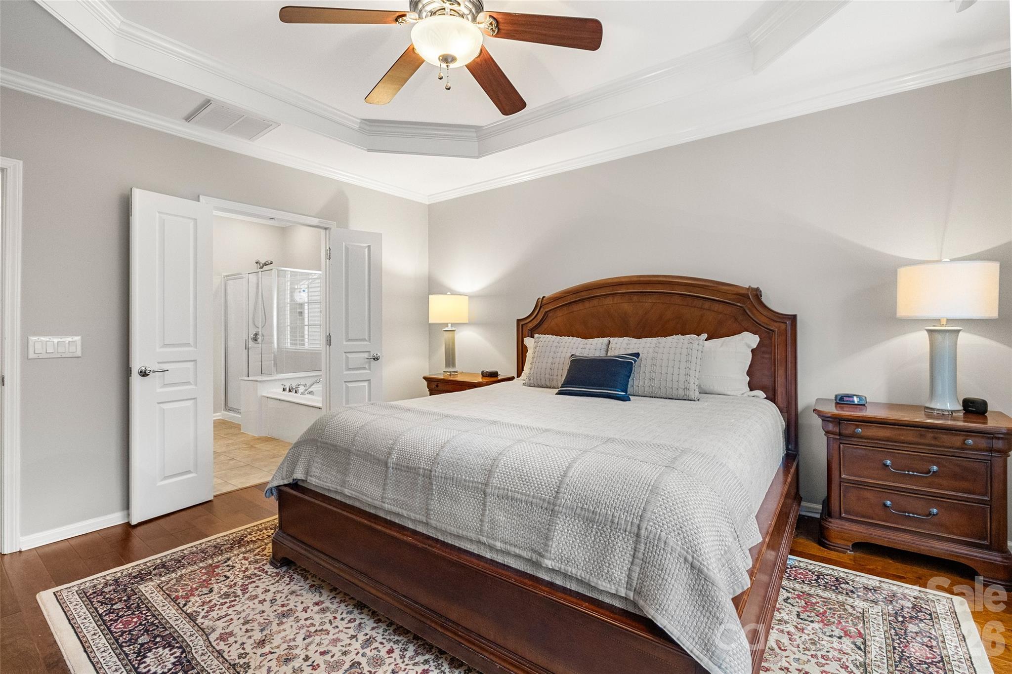 10564 Bethpage Drive Fort Mill, SC 29707 - Photo 18 of 47 a bedroom with a bed and wooden floor