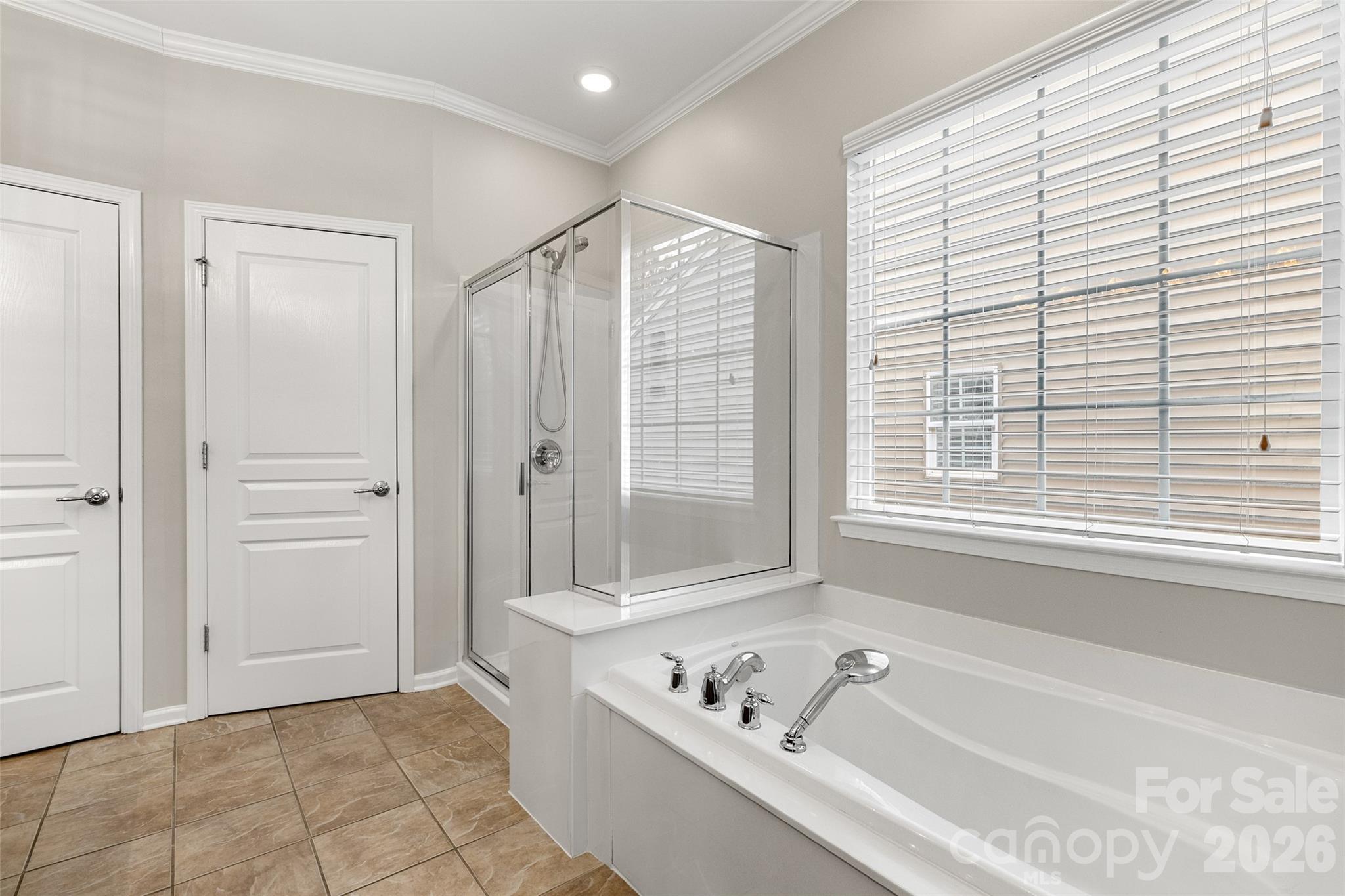 10564 Bethpage Drive Fort Mill, SC 29707 - Photo 20 of 47 a bathroom with a bathtub and a shower