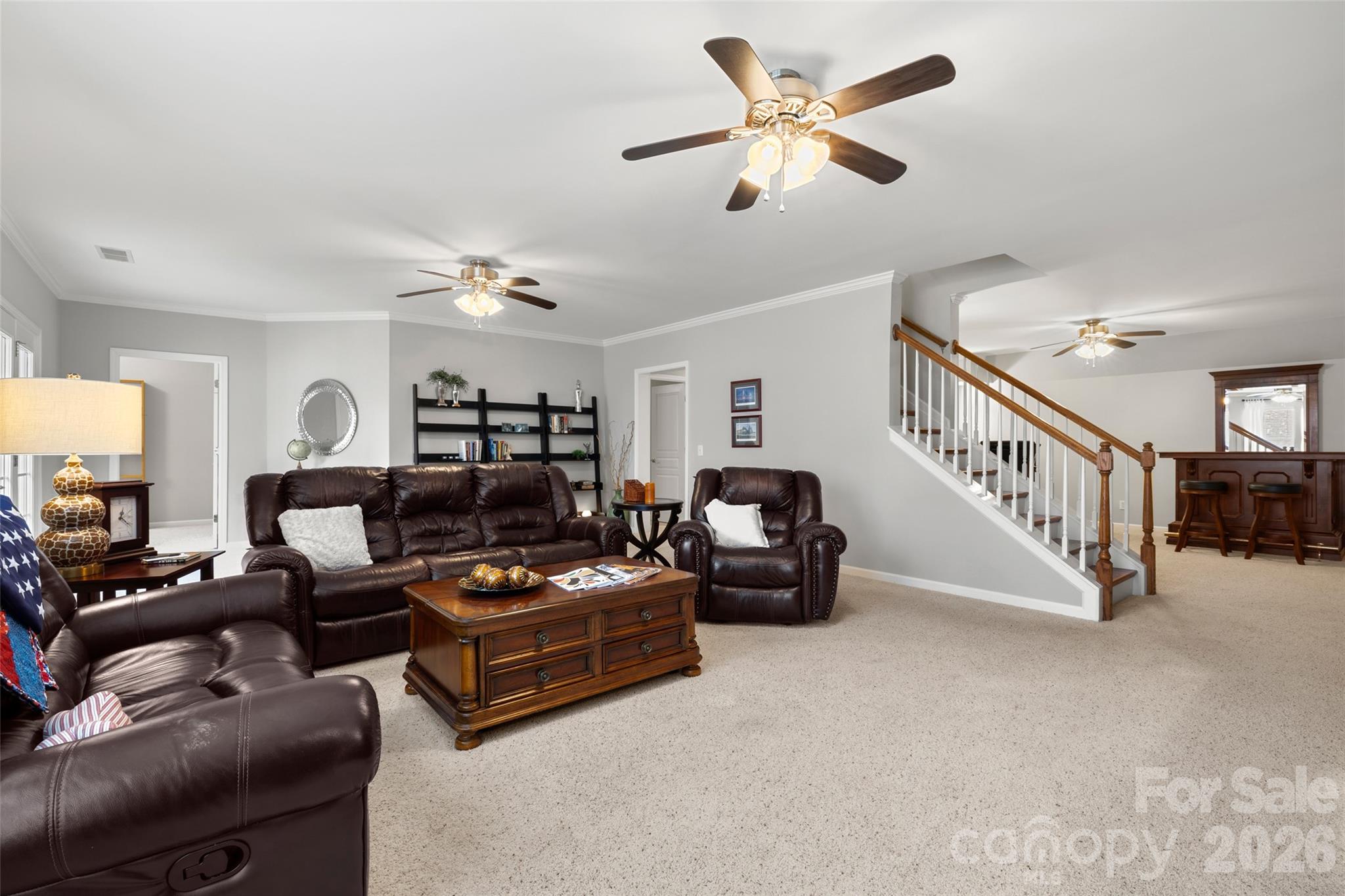 10564 Bethpage Drive Fort Mill, SC 29707 - Photo 26 of 47 a living room with furniture and a chandelier