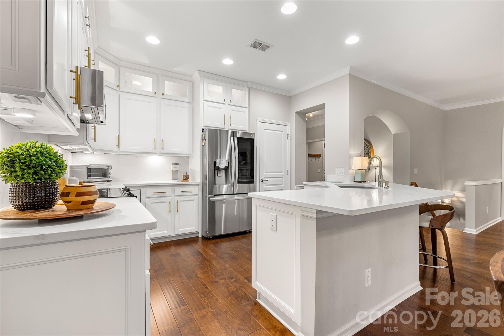 10564 Bethpage Drive Fort Mill, SC 29707 - Photo 4 of 47 a kitchen that has a sink a refrigerator and a stove