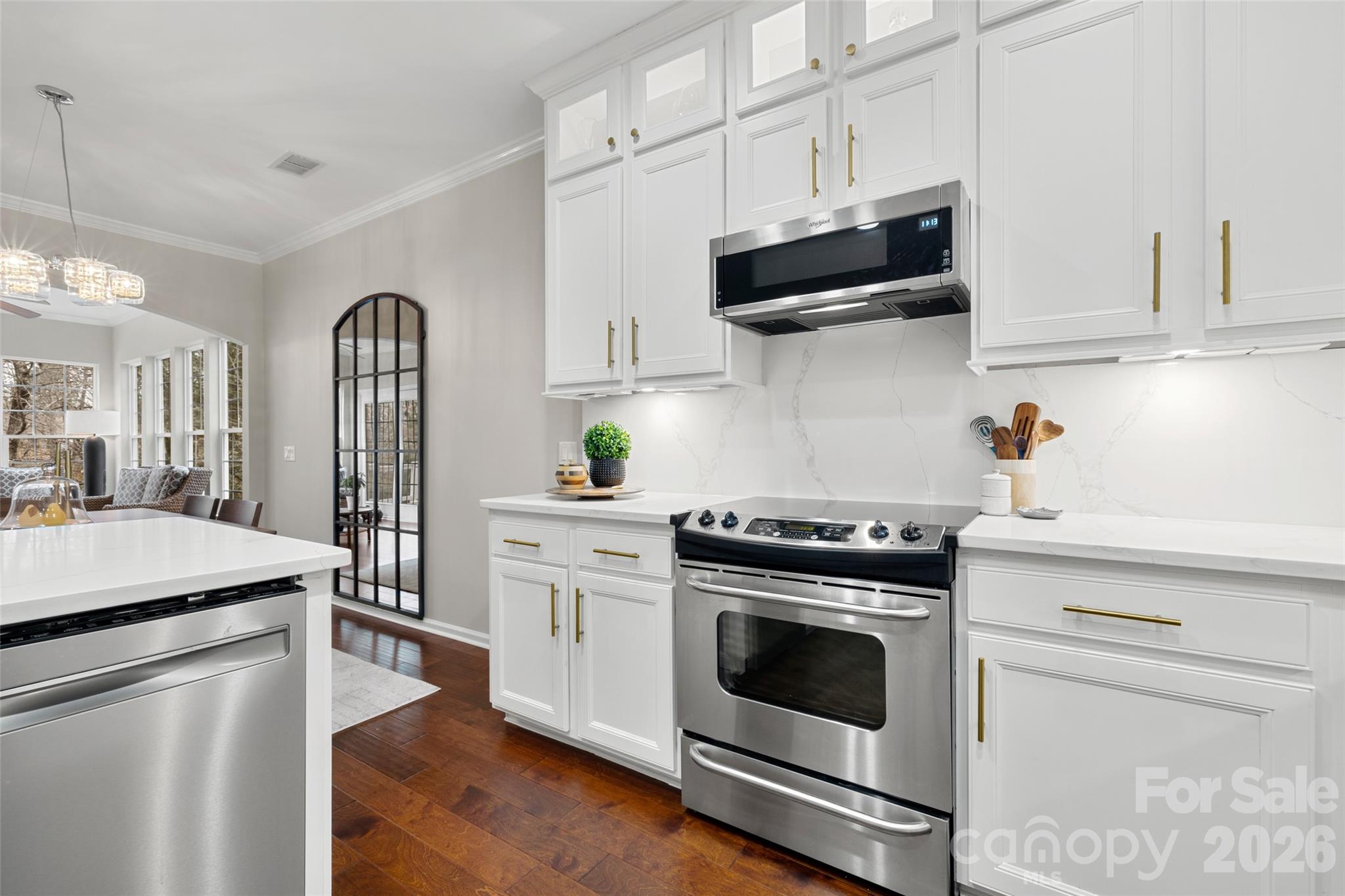 10564 Bethpage Drive Fort Mill, SC 29707 - Photo 7 of 47 a kitchen with cabinets stainless steel appliances and wooden floor