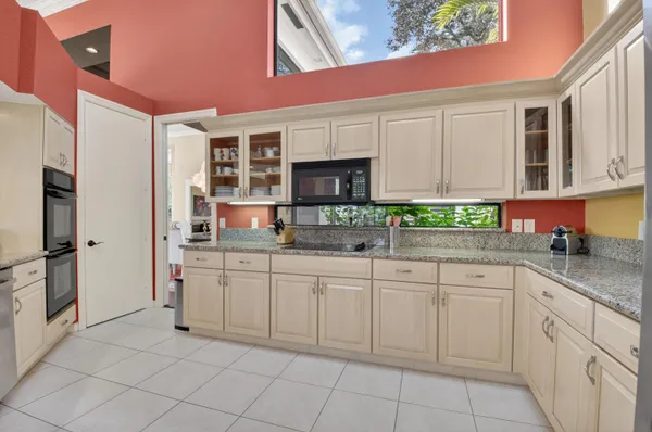 a kitchen with stainless steel appliances granite countertop a stove and a sink
