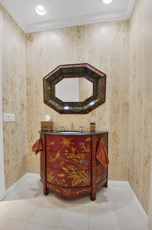 a large white bathroom with a granite countertop sink mirror and bathtub