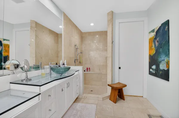 a kitchen with stainless steel appliances granite countertop white cabinets sink and granite counter tops