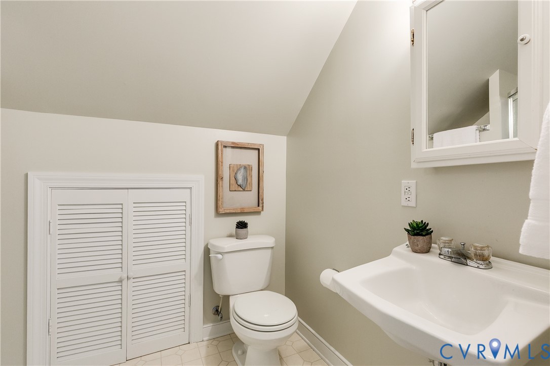 509 Wadeward Road Henrico, VA 23229 - Photo 53 of 59 a bathroom with a toilet a sink and mirror
