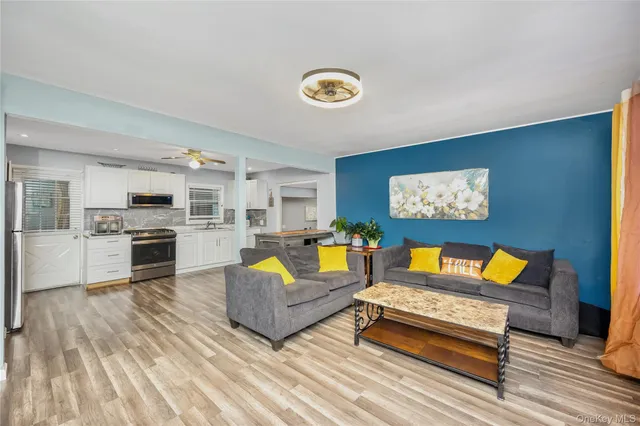a living room with furniture and a fireplace