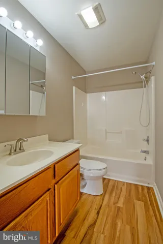a bathroom with a sink a toilet and a bathtub