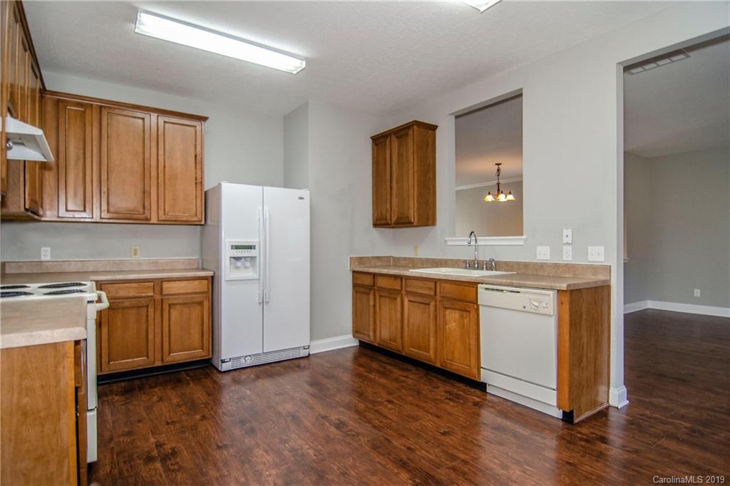 14232 Luscombe Farm Road Charlotte, NC 28278 - Photo 14 of 29 a view with granite countertop cabinets and wooden floor