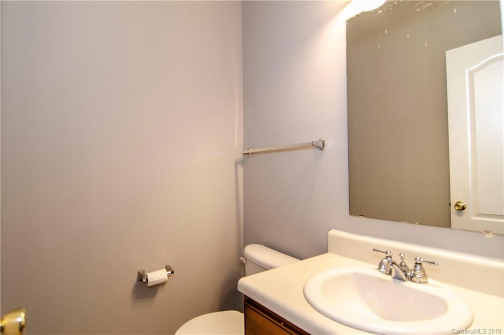 14232 Luscombe Farm Road Charlotte, NC 28278 - Photo 16 of 29 a bathroom with a sink and a mirror