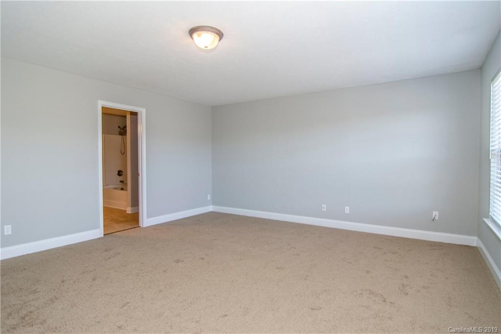 14232 Luscombe Farm Road Charlotte, NC 28278 - Photo 20 of 29 an empty room with an entryway and window
