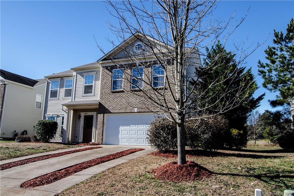 14232 Luscombe Farm Road Charlotte, NC 28278 - Photo 3 of 29 a front view of a house with garden