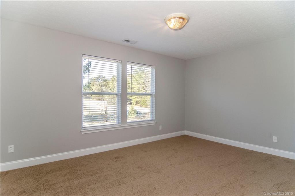 14232 Luscombe Farm Road Charlotte, NC 28278 - Photo 25 of 29 an empty room with a window