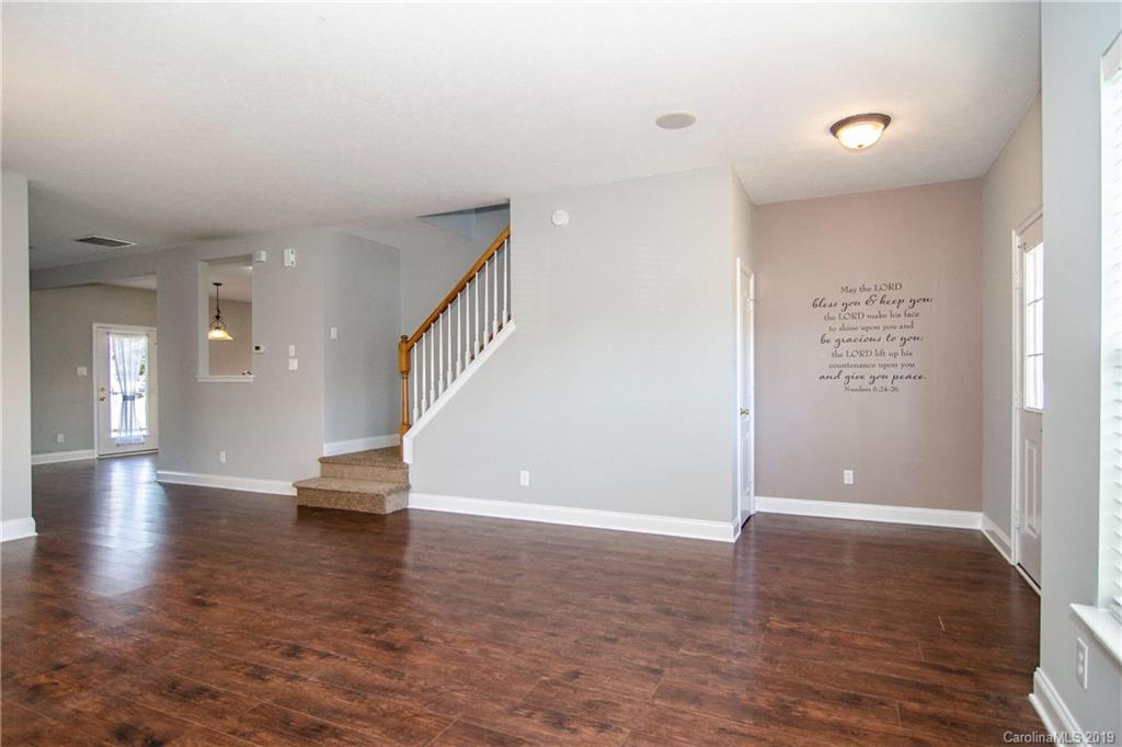 14232 Luscombe Farm Road Charlotte, NC 28278 - Photo 5 of 29 a view of empty room with wooden floor