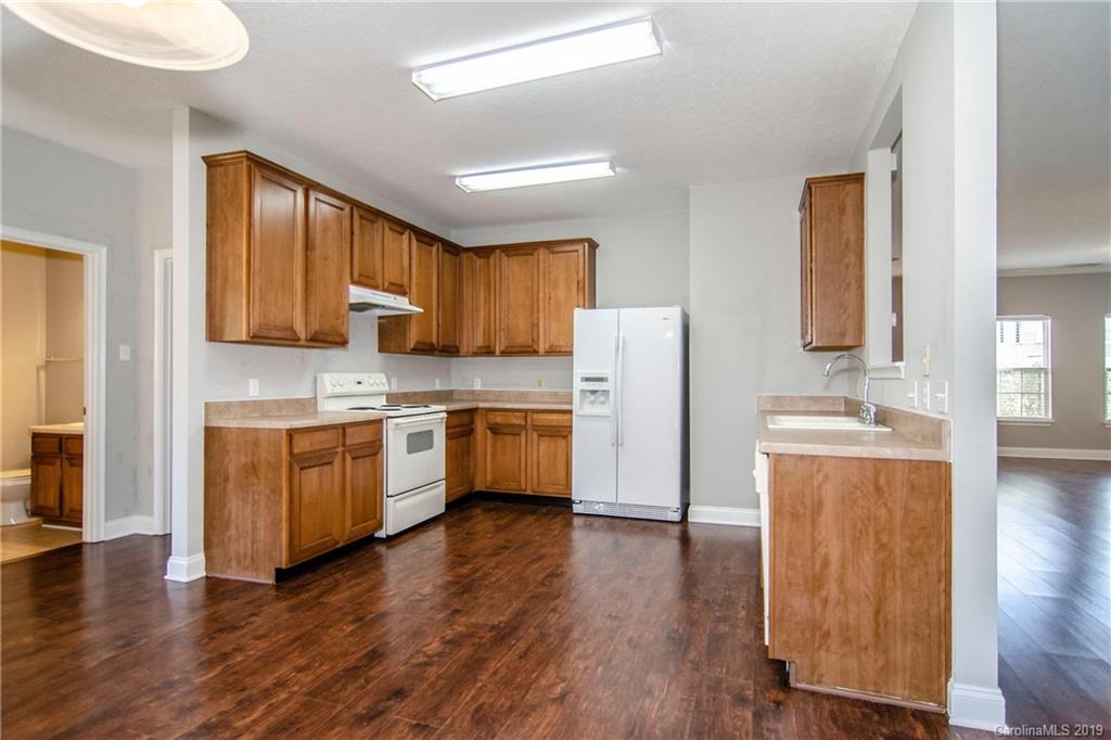 14232 Luscombe Farm Road Charlotte, NC 28278 - Photo 10 of 29 a kitchen with stainless steel appliances sink refrigerator and microwave