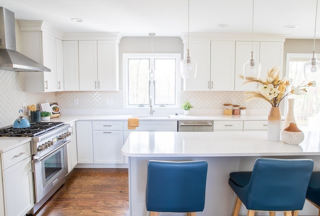 10 Stanley Road Middleton, MA 01949 - Photo 17 of 42 a kitchen with stainless steel appliances a sink stove and white cabinets
