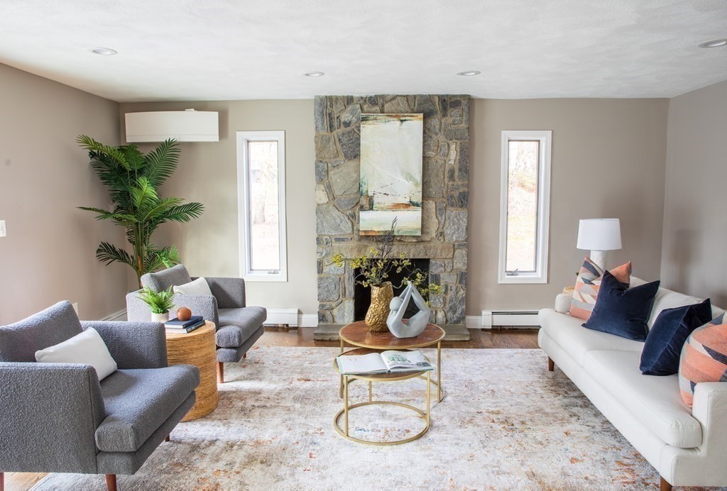 10 Stanley Road Middleton, MA 01949 - Photo 22 of 42 a living room with furniture a dining table and a potted plant