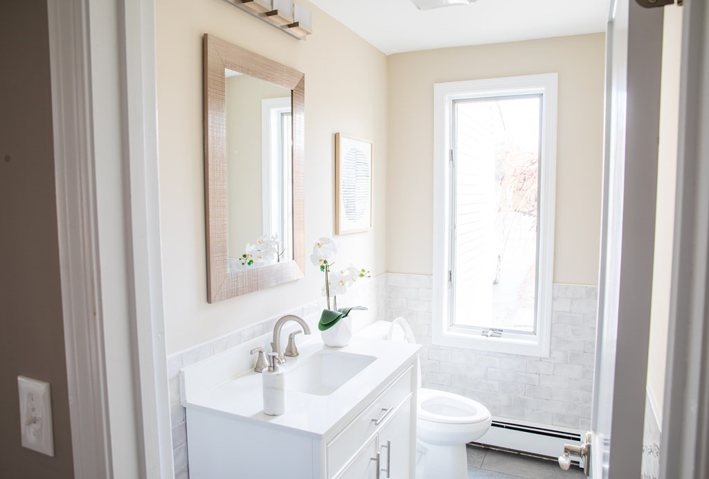 10 Stanley Road Middleton, MA 01949 - Photo 26 of 42 a bathroom with a sink a toilet and a mirror