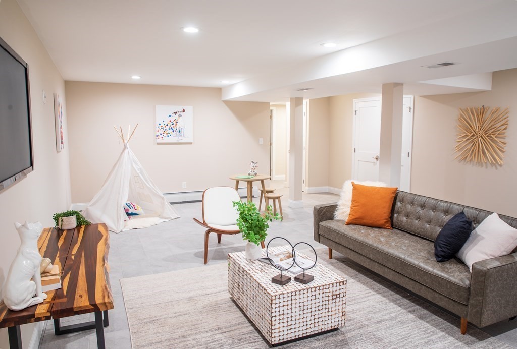 10 Stanley Road Middleton, MA 01949 - Photo 37 of 42 a living room with furniture and a flat screen tv