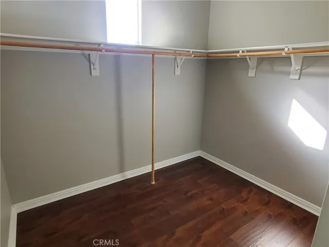 a view of a room with wooden floor and closet