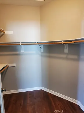 an empty room with a wooden floor