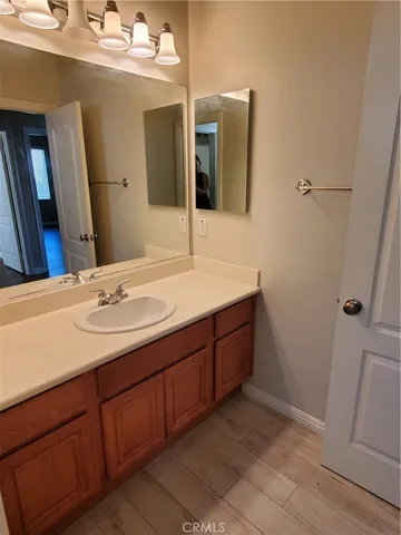 a bathroom with a double vanity sink and mirror