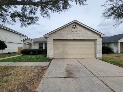 a view of garage yard and tree