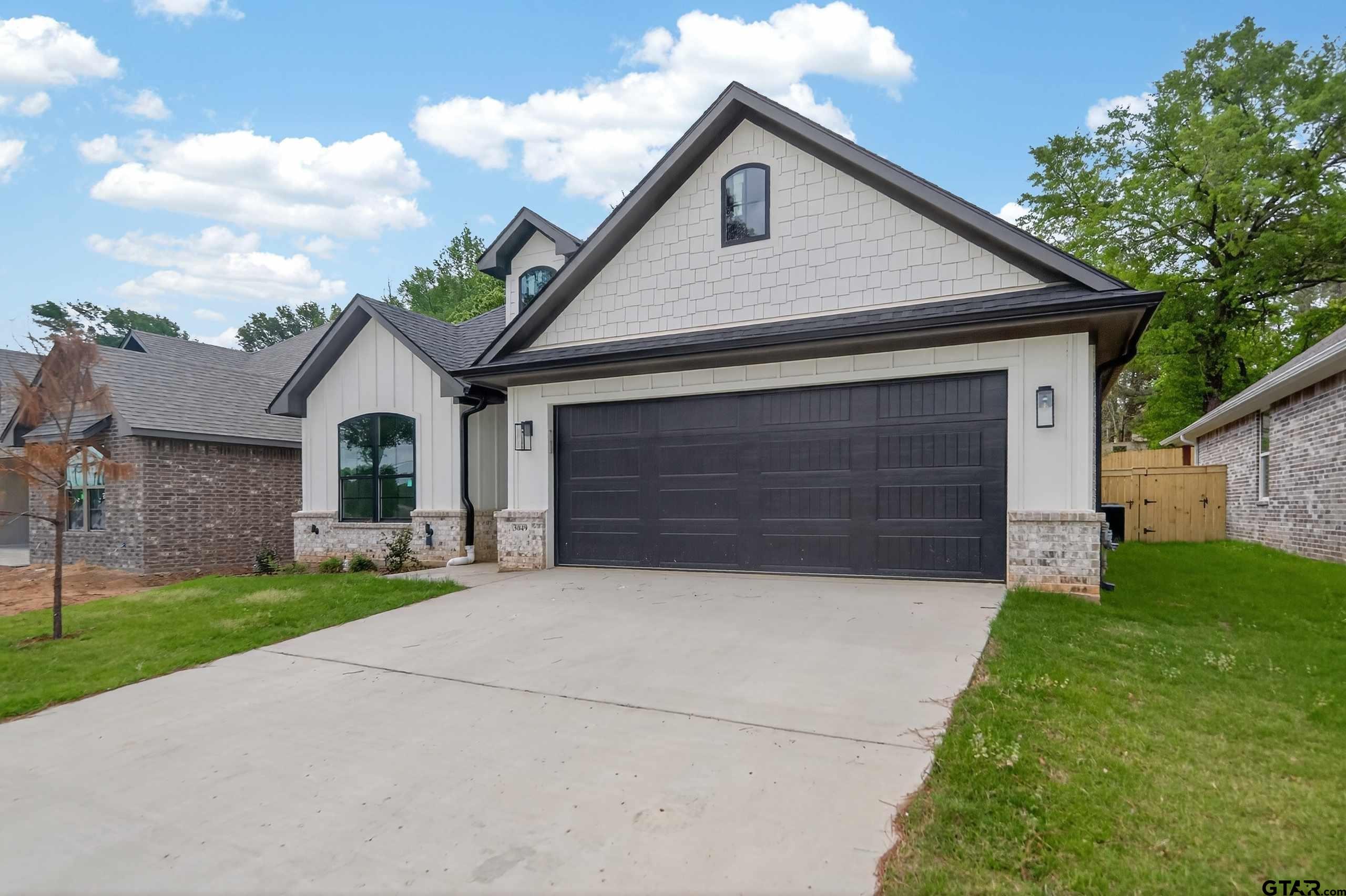 a house view with a garden space