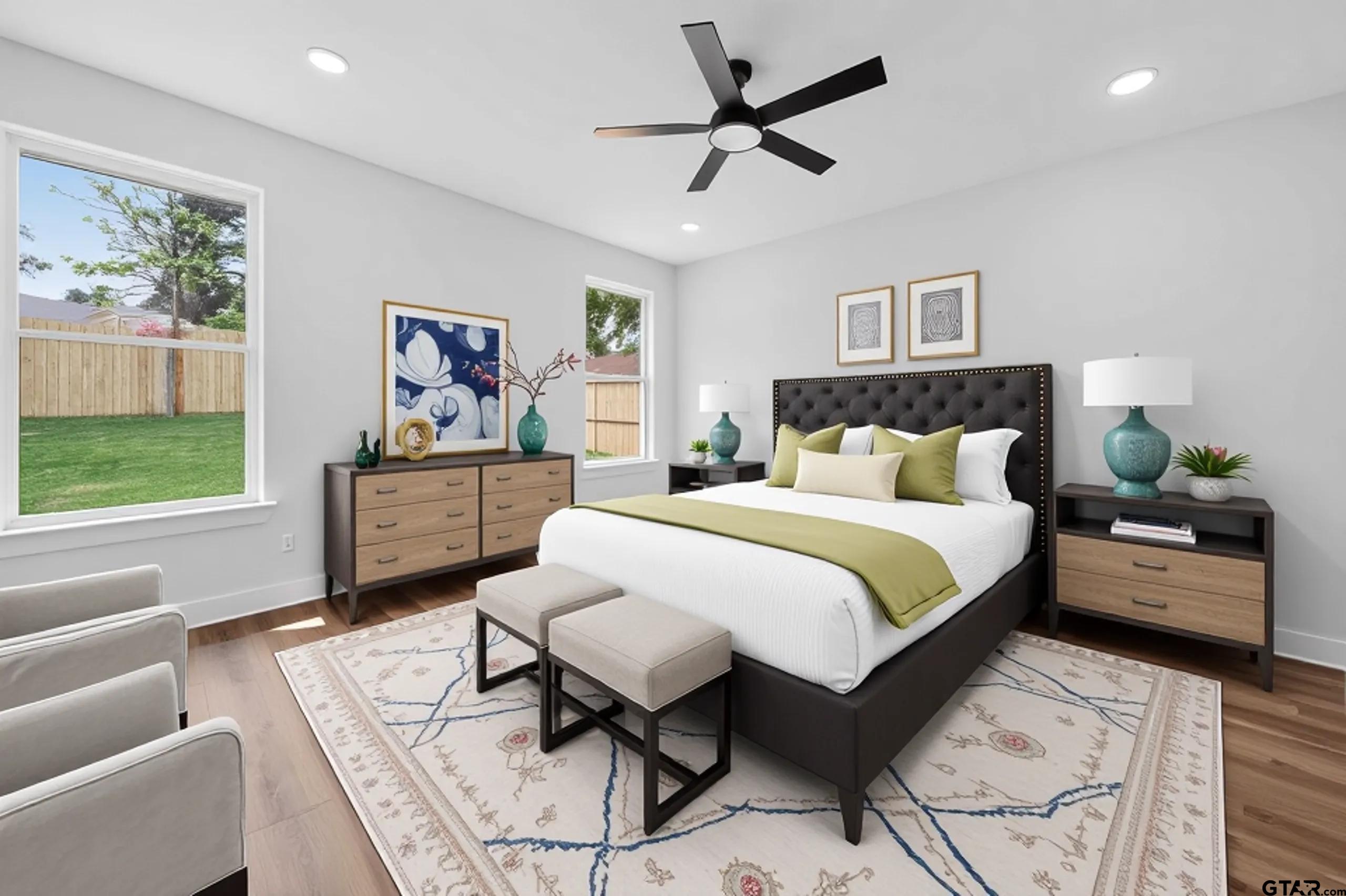 3045 Guinn Farms Road Tyler, TX 75707 - Photo 18 of 45 a bedroom with a bed a couch and a window