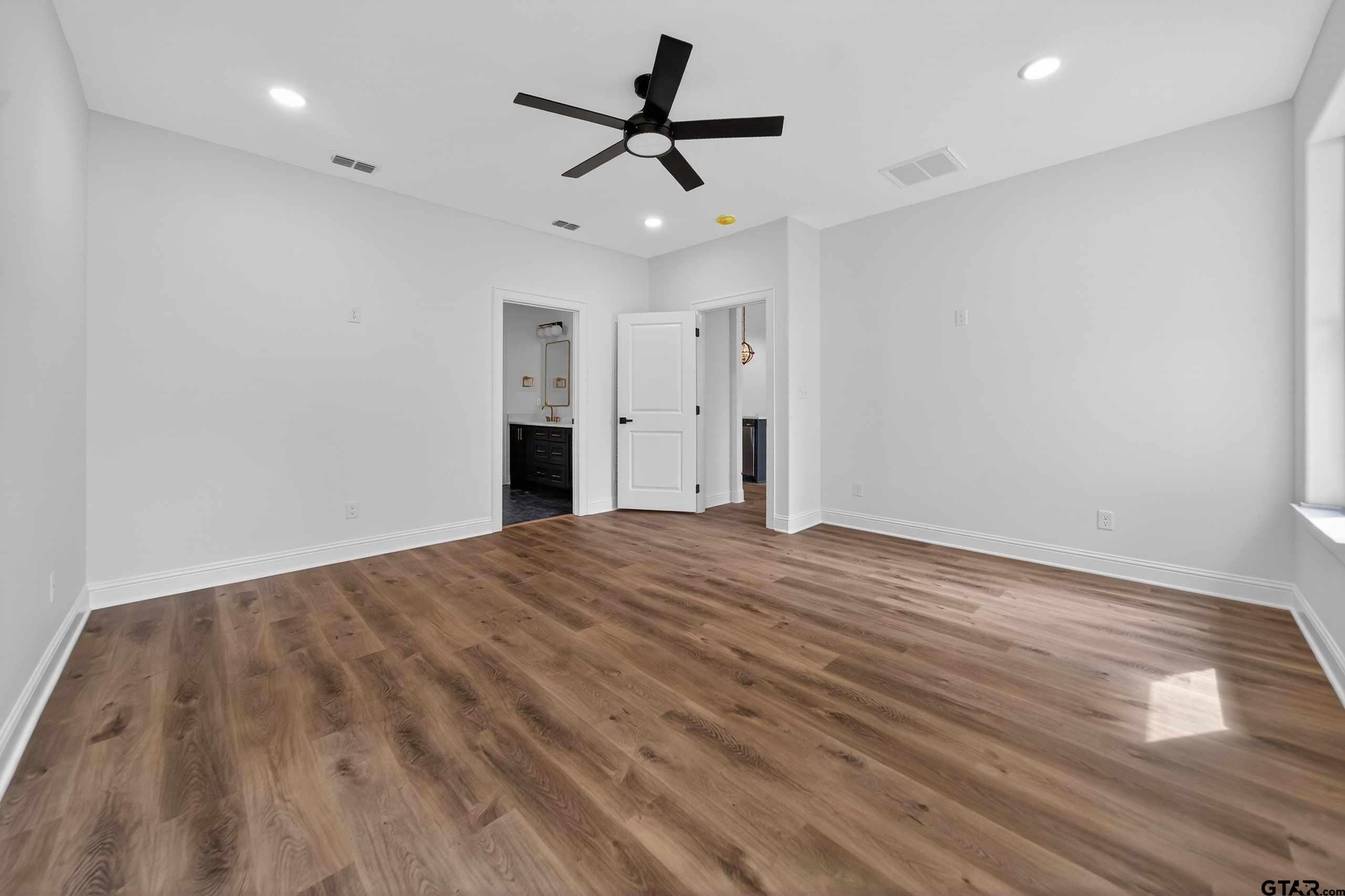 3045 Guinn Farms Road Tyler, TX 75707 - Photo 19 of 45 a view of empty room with wooden floor
