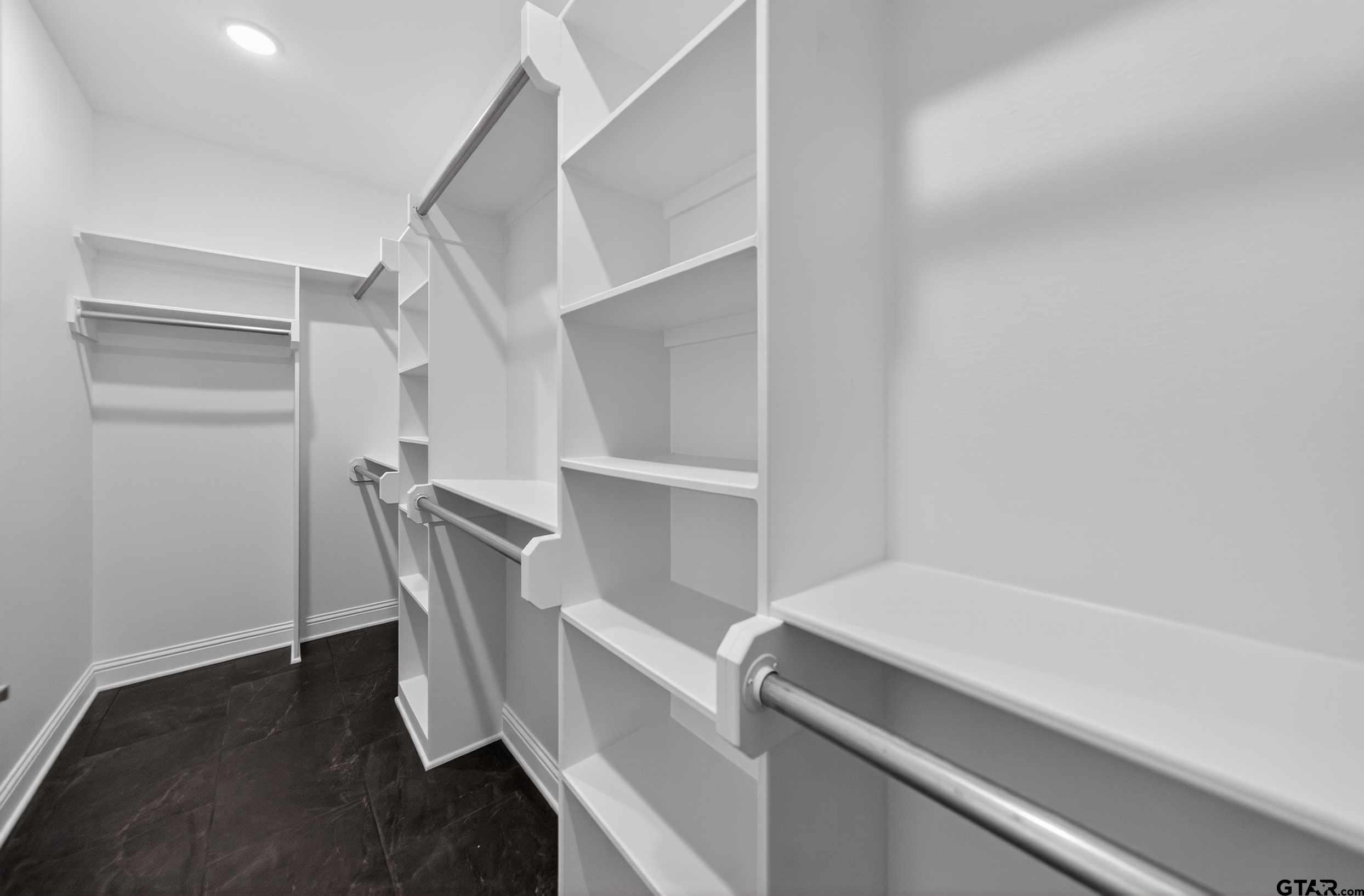 3045 Guinn Farms Road Tyler, TX 75707 - Photo 26 of 45 a hallway with chairs and wooden floor