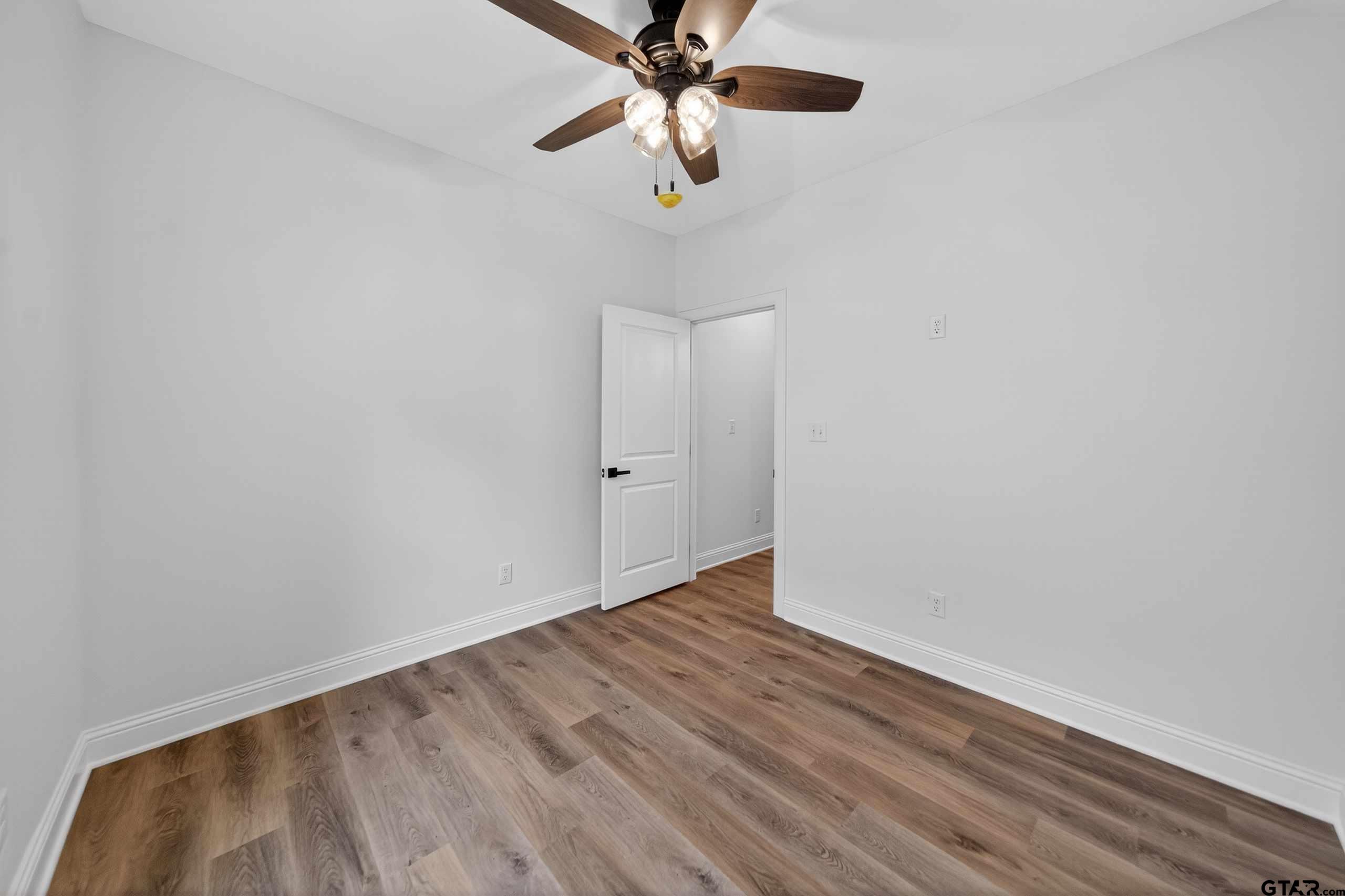 3045 Guinn Farms Road Tyler, TX 75707 - Photo 31 of 45 a view of an empty room with a window