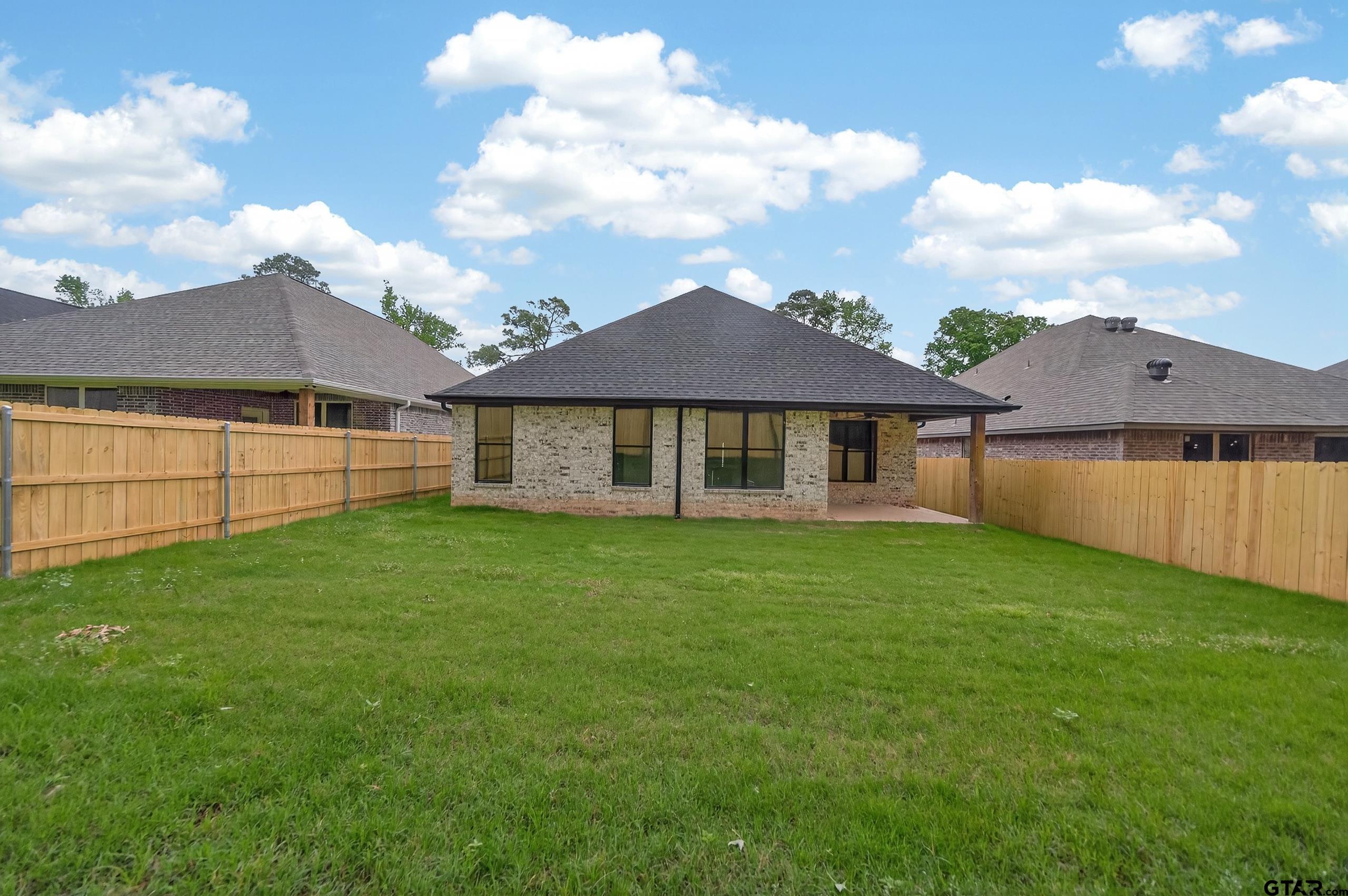 3045 Guinn Farms Road Tyler, TX 75707 - Photo 42 of 45 a view of a yard with a house