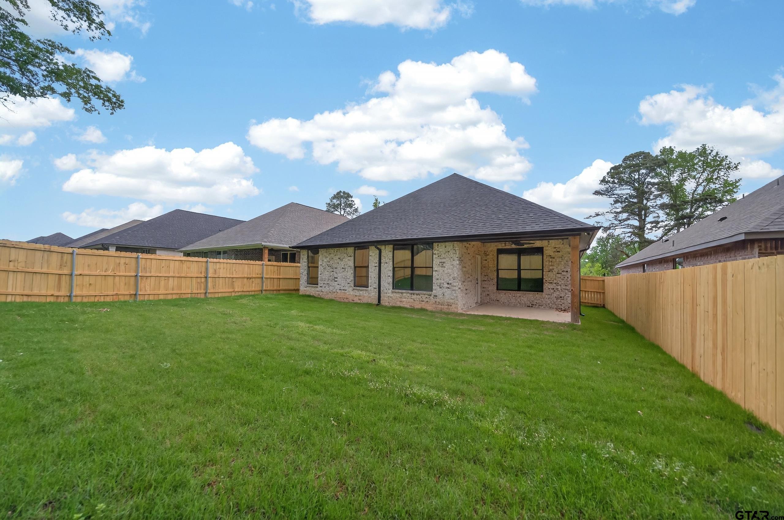 3045 Guinn Farms Road Tyler, TX 75707 - Photo 43 of 45 a view of an house with backyard space and balcony
