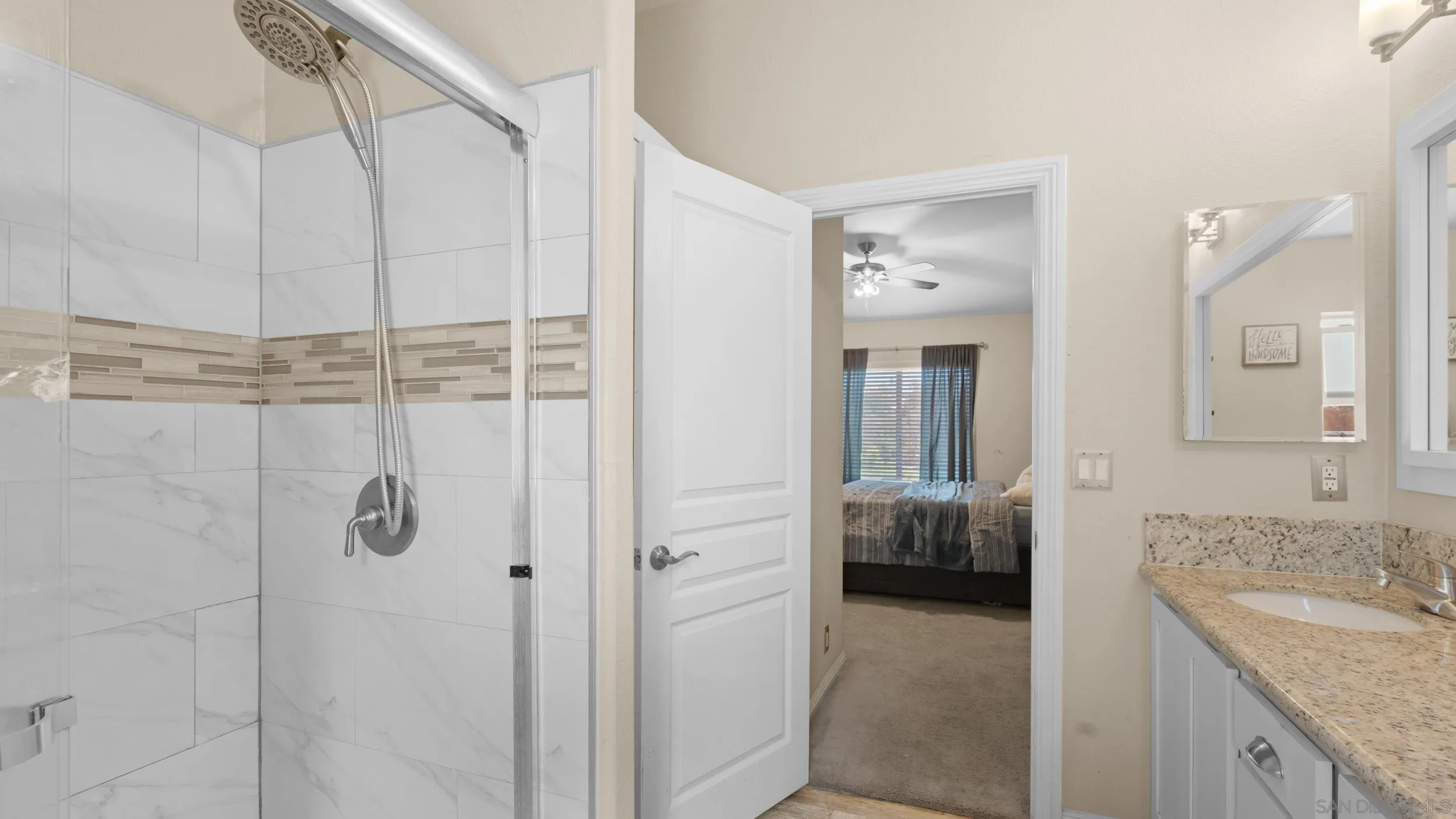 1140 Old Mountain View Road El Cajon, CA 92021 - Photo 14 of 25 a en suite bathroom with a granite countertop sink and a mirror