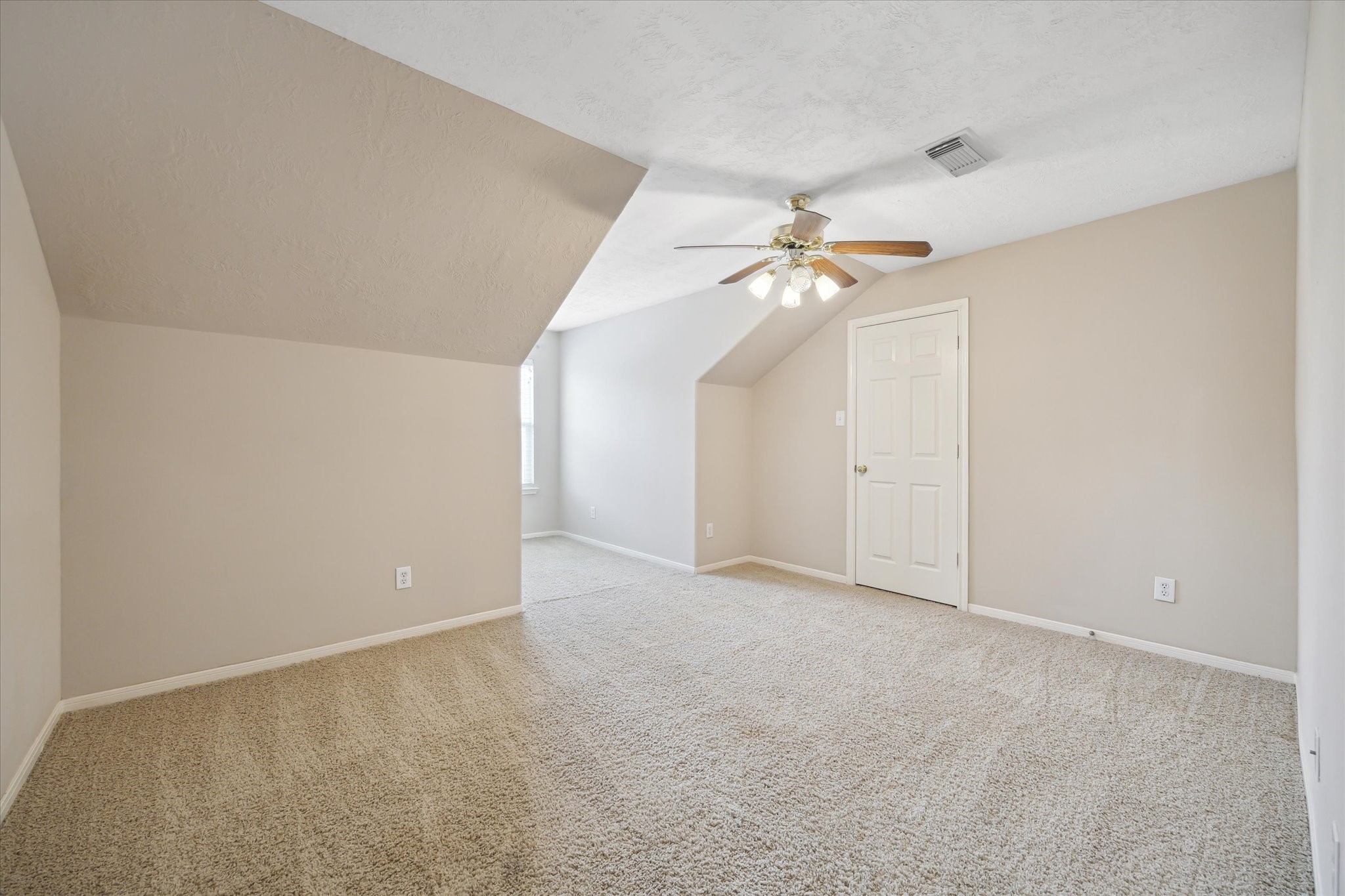 2411 Lacyberry Street Houston, TX 77080 - Photo 11 of 20 a view of an empty room with a ceiling fan