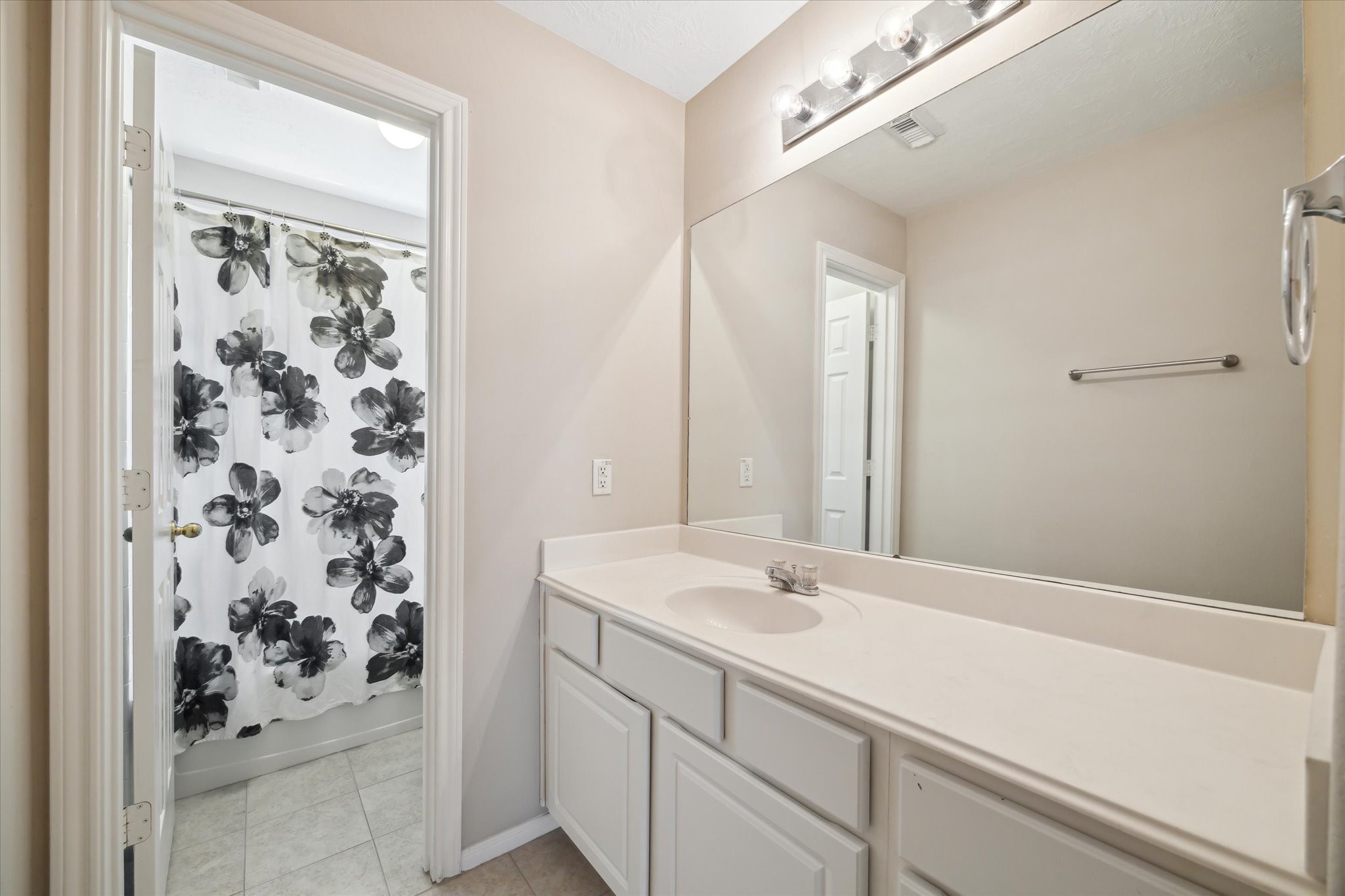 2411 Lacyberry Street Houston, TX 77080 - Photo 12 of 20 a bathroom with a sink and a mirror