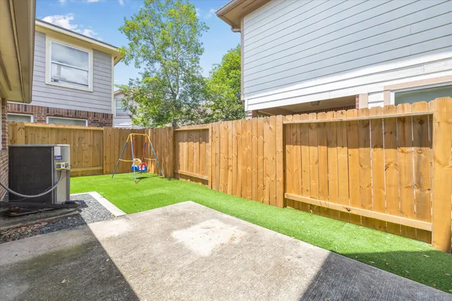 a view of backyard with a garden and plants