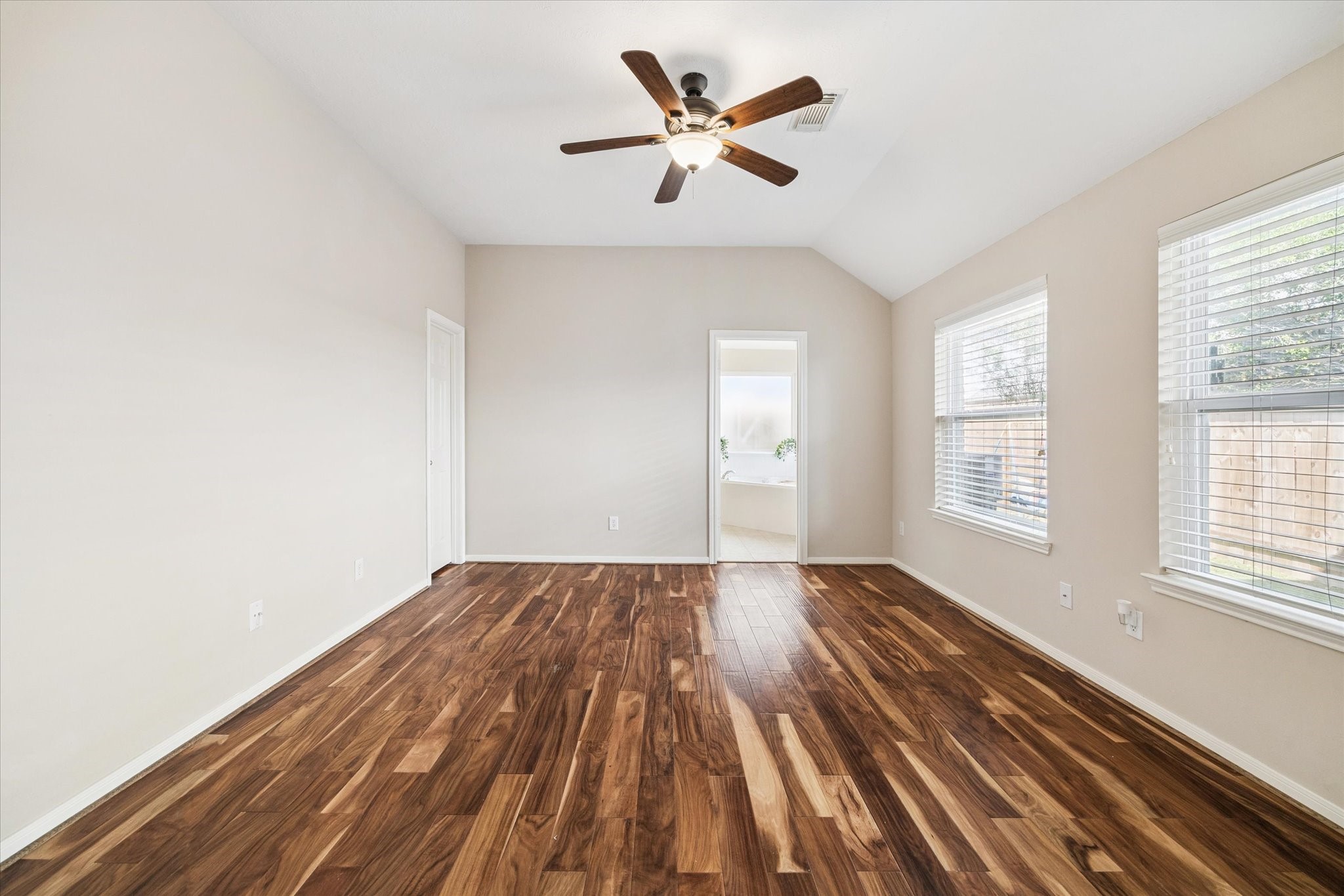 2411 Lacyberry Street Houston, TX 77080 - Photo 16 of 20 wooden floor in an empty room with a window