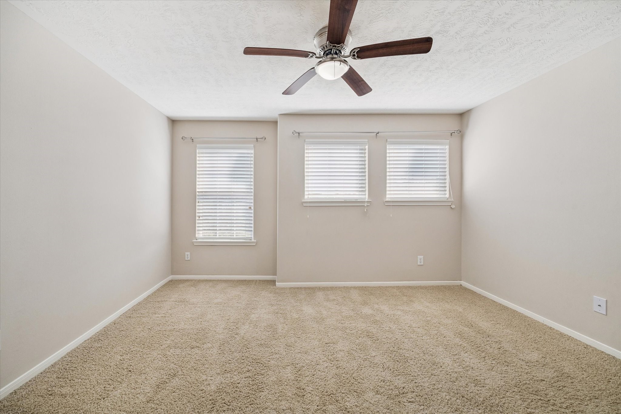 2411 Lacyberry Street Houston, TX 77080 - Photo 20 of 20 an empty room with a window and a fan