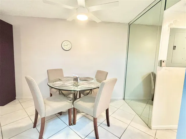 a view of a chairs and tables in the patio of a house