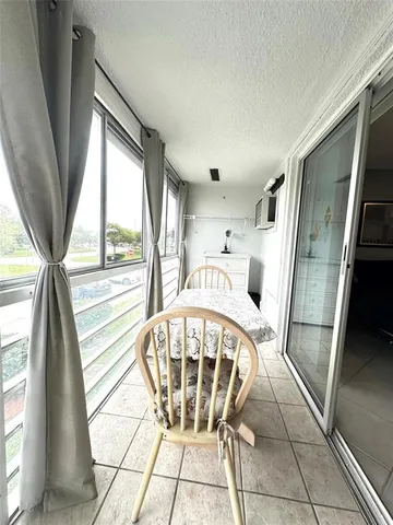 a view of a glass door with a yard