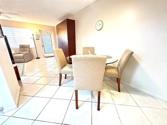 a living room with a couch and a floor to ceiling window