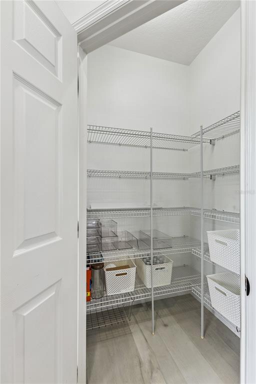 609 Rhodes Drive DeLand, FL 32720 - Photo 11 of 32 a room with racks on the wall and a window