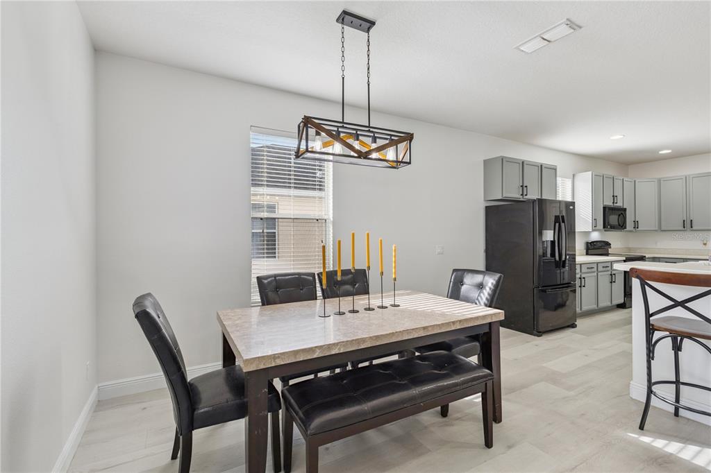 609 Rhodes Drive DeLand, FL 32720 - Photo 12 of 32 a view of a dining room with furniture