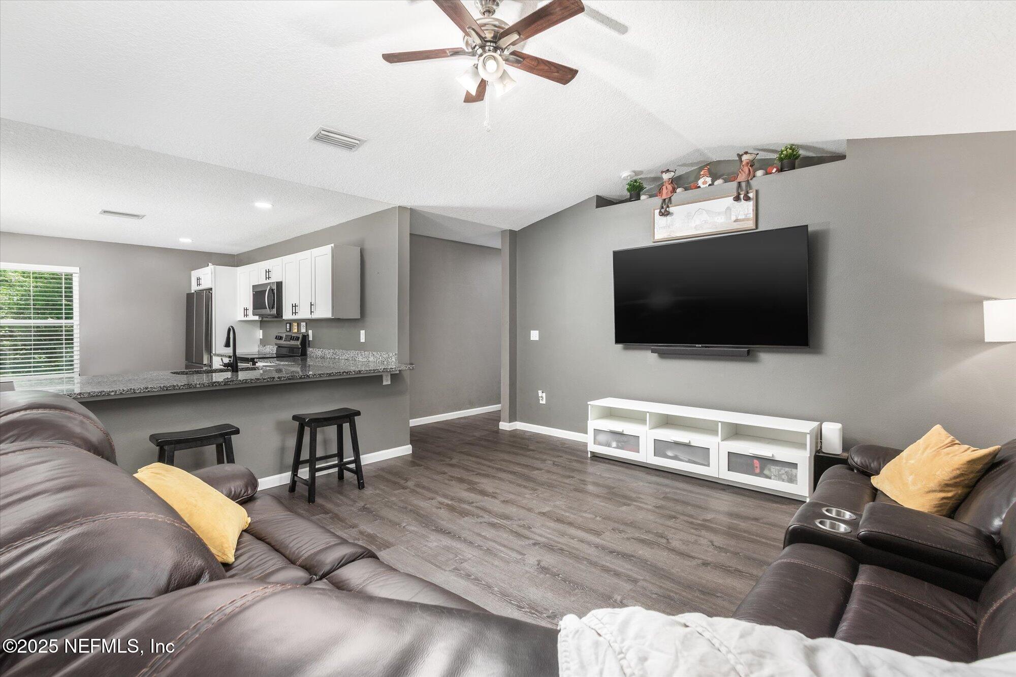 3615 Weaver Road Palatka, FL 32177 - Photo 11 of 30 a living room with furniture and a flat screen tv