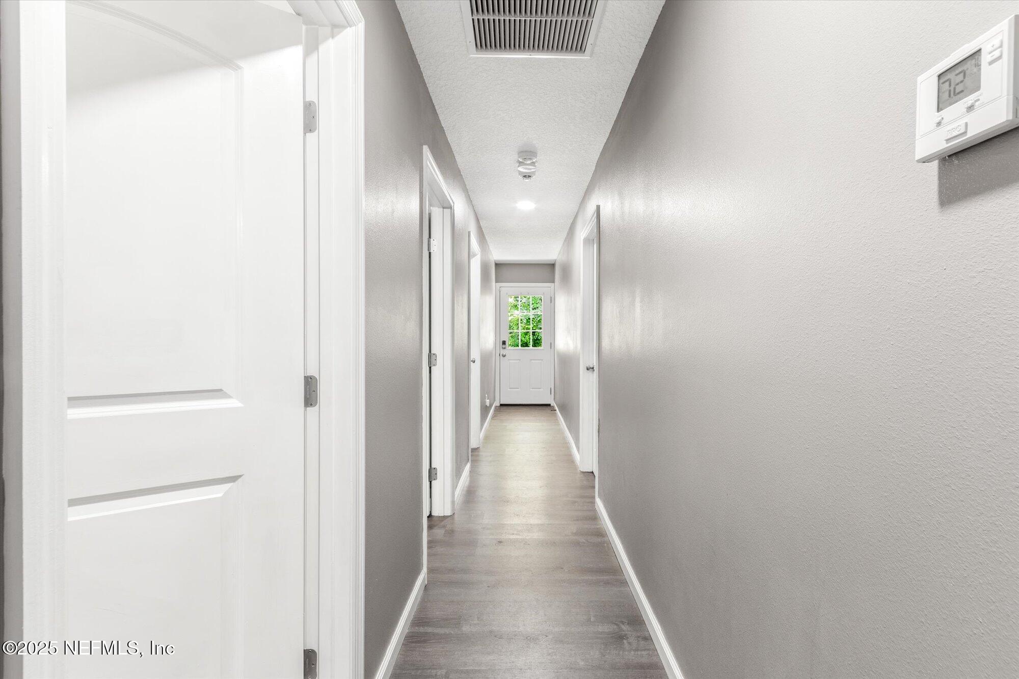 3615 Weaver Road Palatka, FL 32177 - Photo 13 of 30 a view of a hallway with wooden floor
