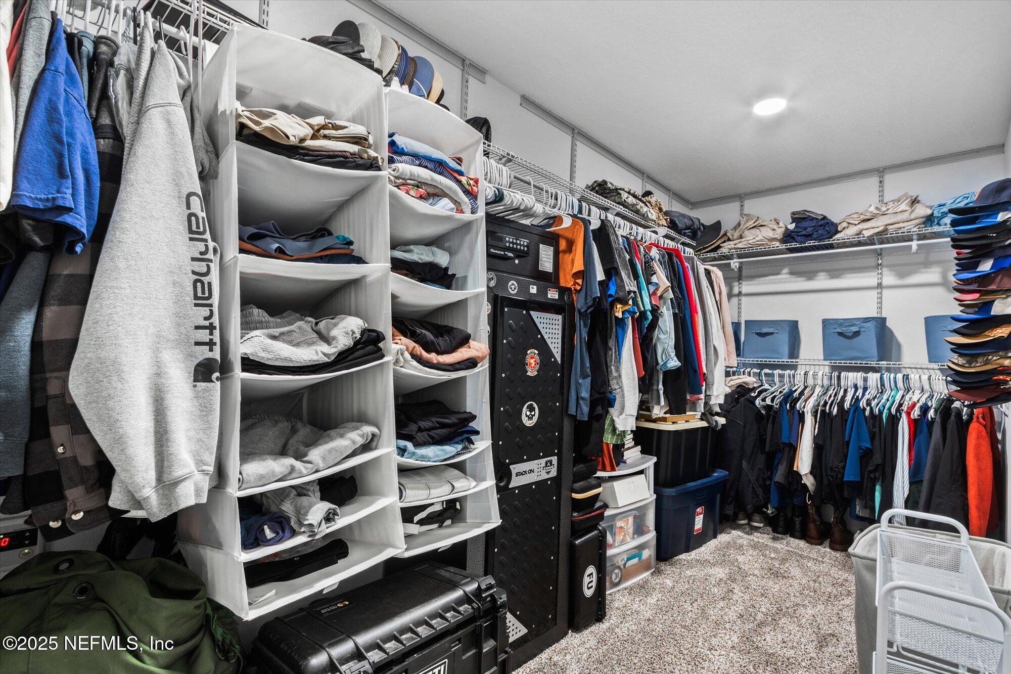 3615 Weaver Road Palatka, FL 32177 - Photo 19 of 30 a view of walk in closet with clothes and shoes