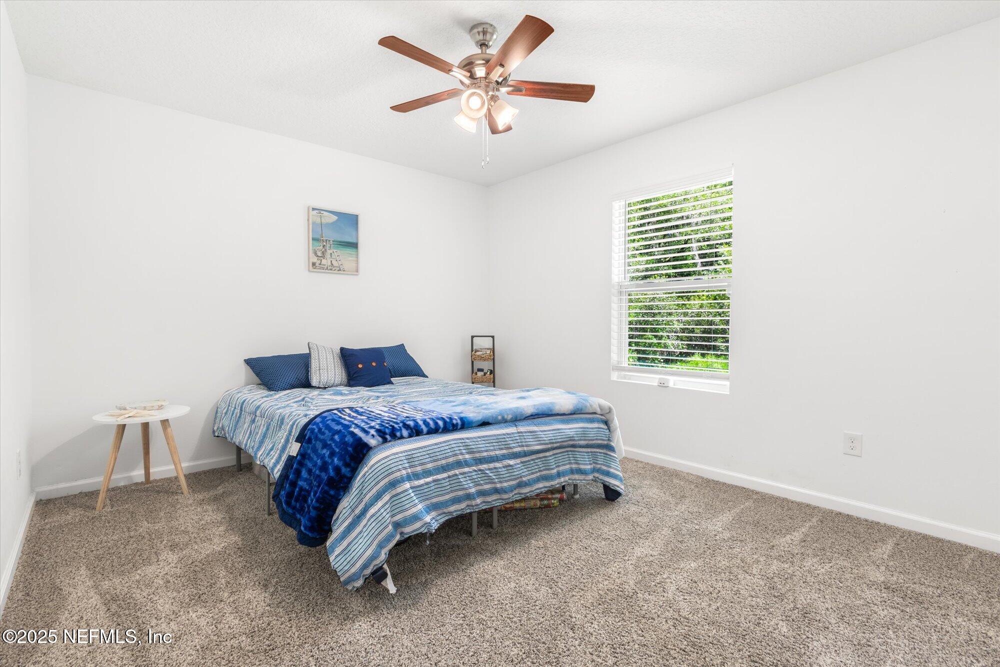 3615 Weaver Road Palatka, FL 32177 - Photo 24 of 30 a spacious bedroom with a bed and a window
